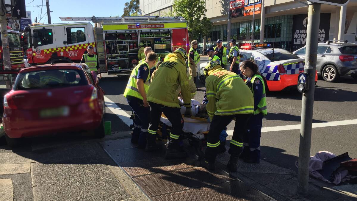 The driver is cared for by Fire and Rescue NSW officers and ambulance paramedics. 