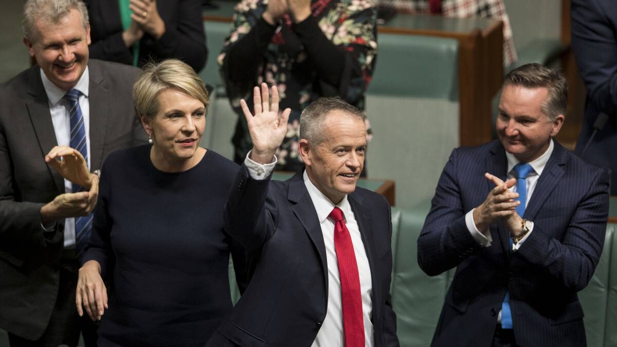 Bill Shorten wins applause from colleagues after his reply to the budget. Picture: Dominic Lorrimer