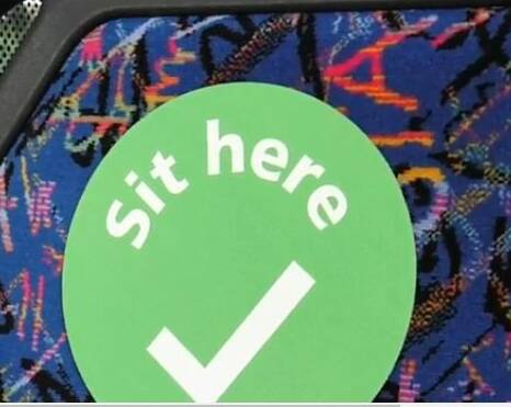Green dot stickers for trains and buses