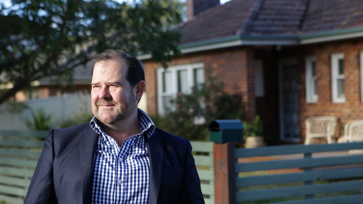 Cameron Kirby outside homes in the Caringbah medical precinct, which the Mark Moran Group has acquired. Picture: John Veage