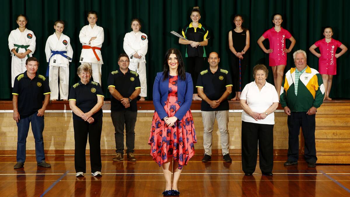 Eleni Petinos with club officials and young members. Image: supplied