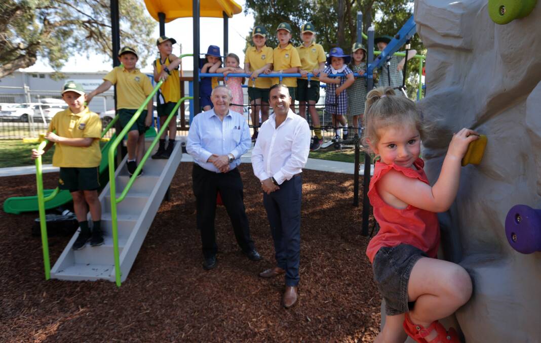 Mayor Carmelo Pesce and Cr Barry Collier with children at a Lilli Pilli playground, which was upgraded in the last council term. Picture by John Veage