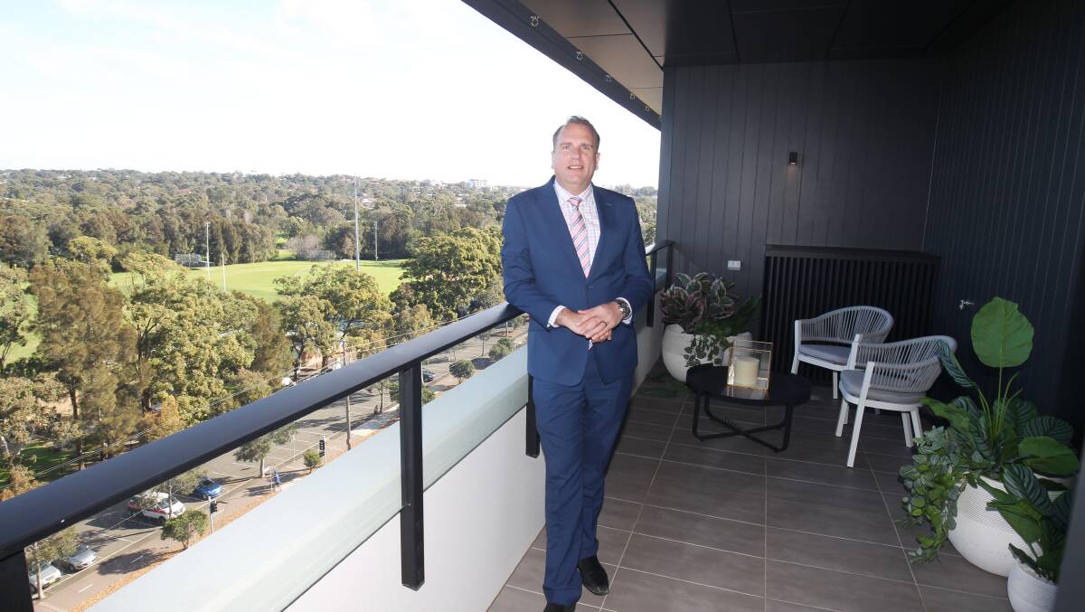 Luke Barbuto, from Highland Property, on the balcony of a new two-bedroom apartment at Woolooware Bay. Picture: Chris Lane