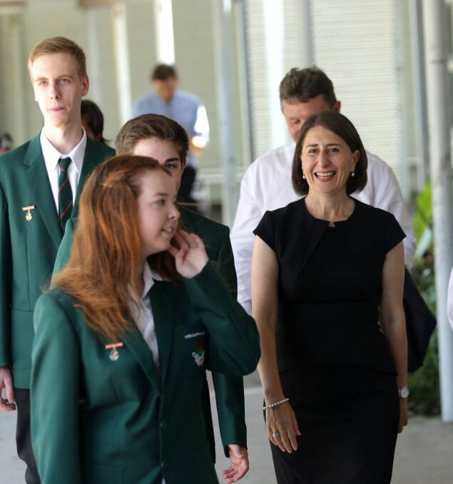 Official visitors and dignitaries, such as Premier Gladys Berejiklian, who is pictured at Heathcote High School in 2019, can return from the start of Term 3. Picture: John Veage