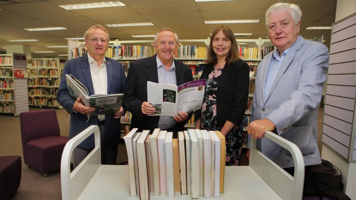 Councillors Tom Croucher (left), Barry Collier and Michael Forshaw and council staff member Kelly Wilson launching the Sutherland Shire Literary Competition, which was introduced by the present council. Picture: John Veage