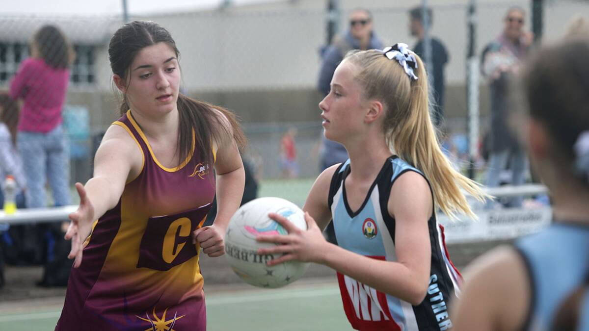Action at Bellingara netball courts in July this year after junior sport resumed. Picture: John Veage