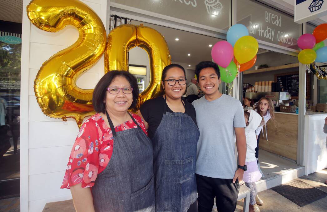 "More than wonderful": Thera Theng and her children Emma and Nicholas celebrate 20 years in the shire with customers on Sunday. Picture: Chris Lane