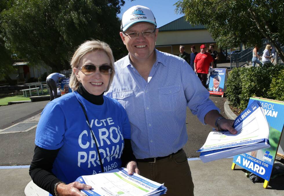 Scott Morrison helps Carol Provan on polling day at the last council election. Picture: John Veage 