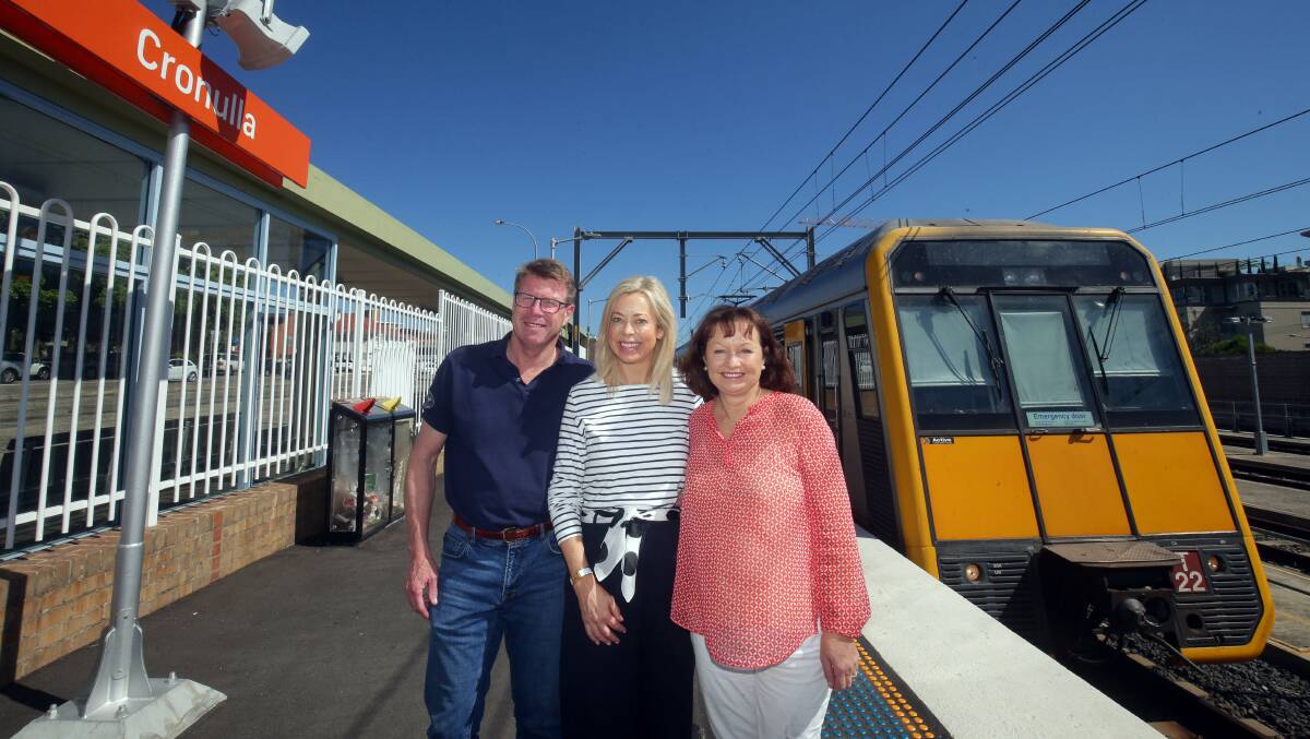 On the right track: Nick and Angela Farr-Jones and Jeanine Treharne at Cronulla station from where a special train will run to the city for the gathering of up to 8000 high school students. Picture: Chris Lane
