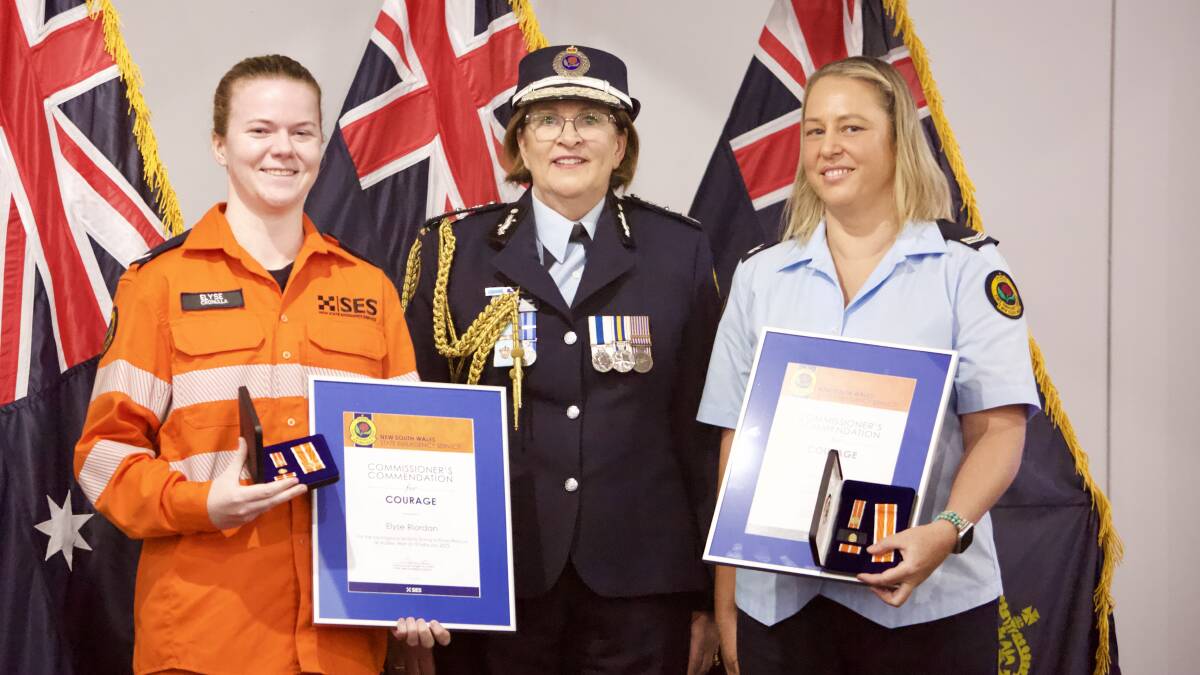 Elyse Riordan (left) and Fiona Butlin receive their awards from SES Commissioner Carlene York. Picture supplied