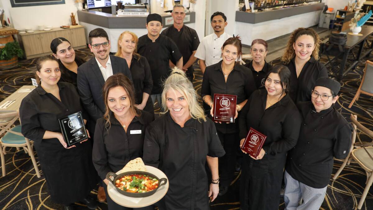 Cove Bar & Grill team, with contractor Gina Louloudakis (left) and head chef Anita Lisson holding the winning dish. Picture by John Veage
