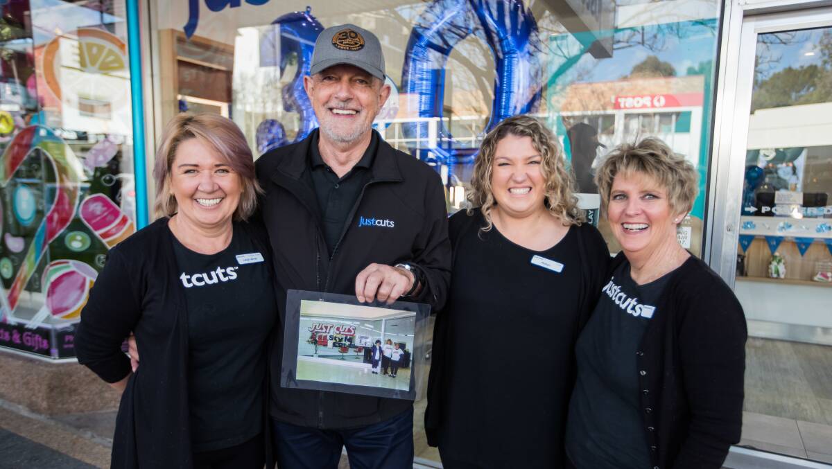 Leigh-Anne Brosens (left), Denis McFadden and Engadine stylists Robyn and Lynette Grose. Denis holds an image of Leigh-Anne and Lynette outside the Engadine salon when it first opened in 1990. Picture: supplied