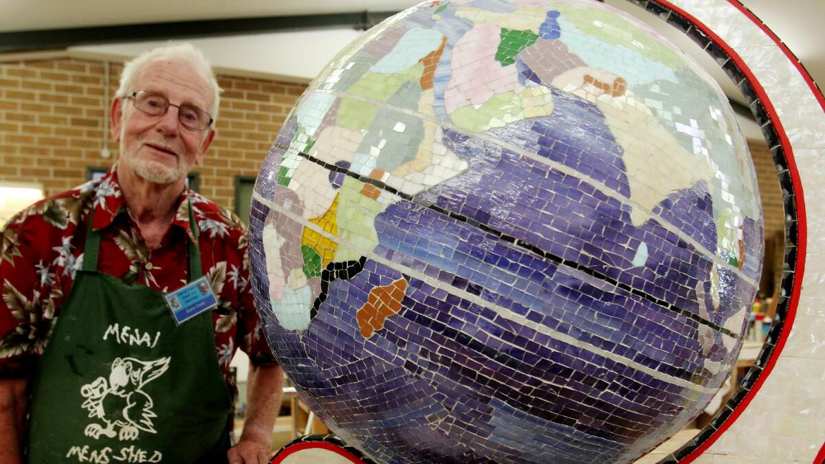 In 2015, John Oste made this globe from 30,000 individually hand-cut pieces of glass. Picture: Chris Lane