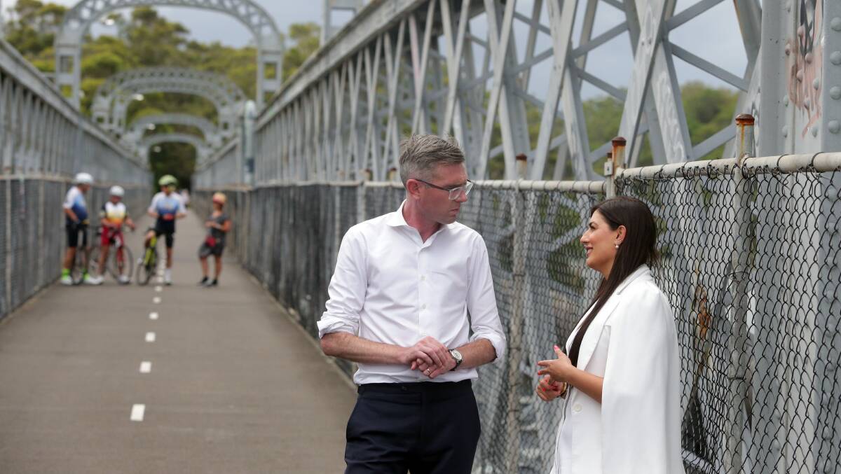 Dominic Perrottet and Eleni Petinos on Como bridge during the election campaign. Picture by Chris Lane
