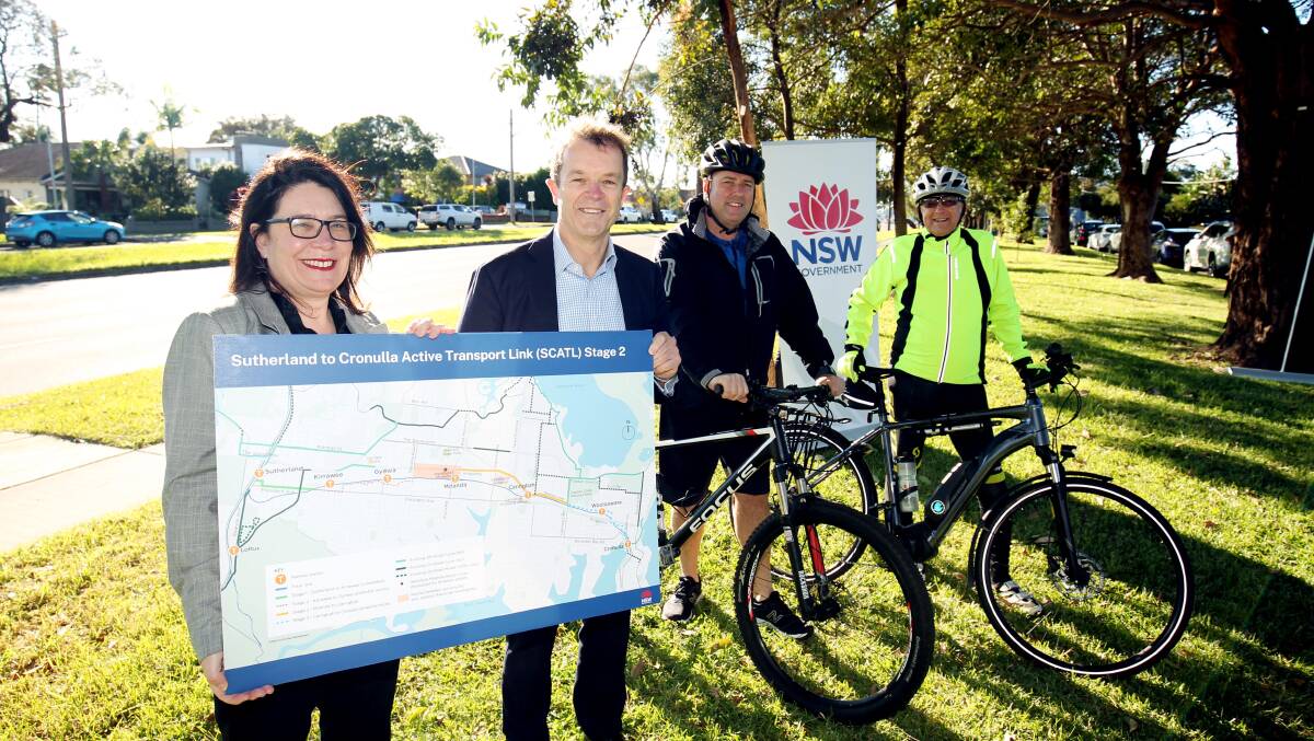Pushing on: Kiersten Fishburn and Mark Speakman with cyclists Steve O'Keefe (left) and Ian Marchant on the cycle route in Malvern Road, Miranda. Picture: Chris Lane