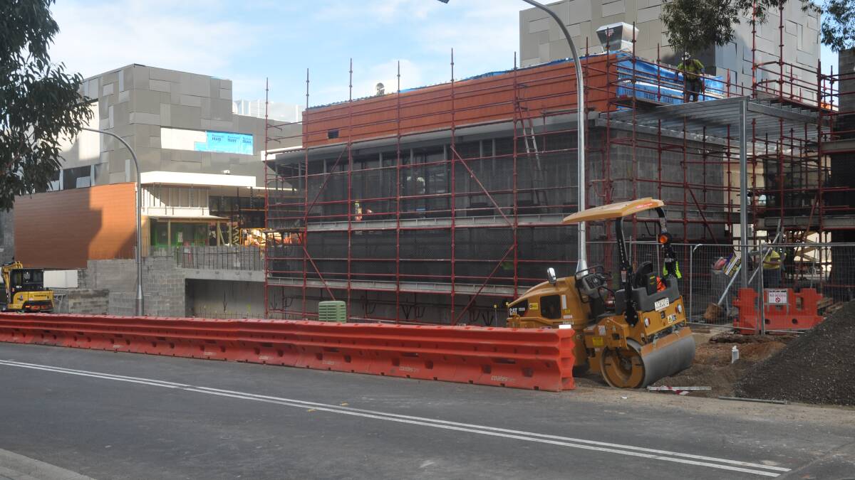 The new Woolworths shopping centre, viewed from Flora Street, under construction.