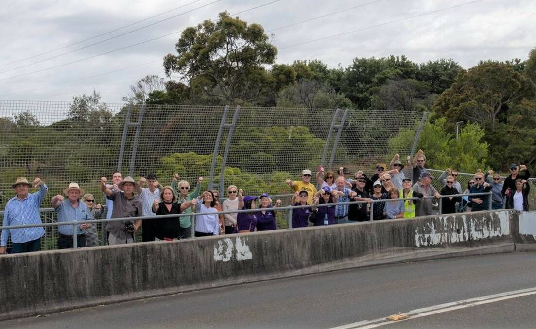 Protesters give the "thumbs down" to Heathcote East commuter car park plans. Picture: David / Michael Oblati