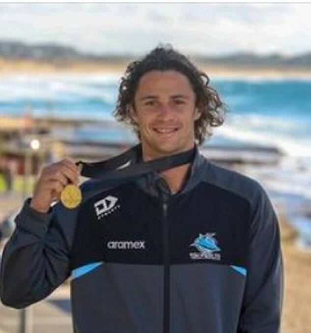 Nicho Hynes with his Dally M Medal at Cronulla beach on the morning after the presentation. Picture Sharks Media
