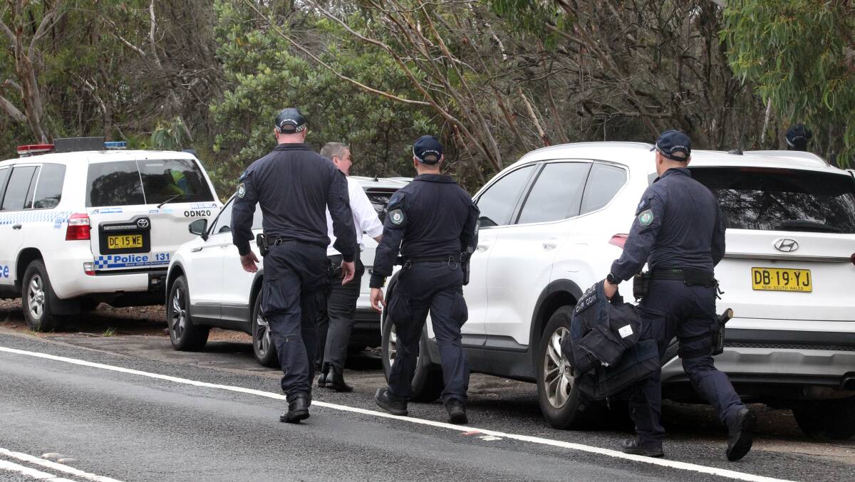 Police search an area in Royal National Park earlier in the day. Picture by Chris Lane
