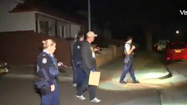 Police search the area after the gunshots. Picture: 9 News