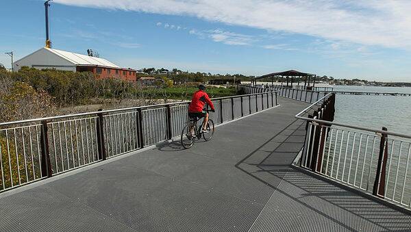The new shared path section behind the Sharks development and football stadium will link with the existing facility (pictured above) around Woolooware Bay. Picture: Simon Bennett
