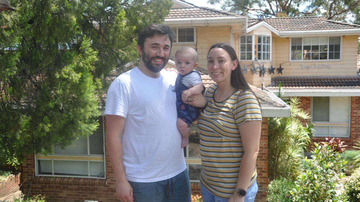 Max and Katy Kabilafkas with Orlando, four months, at their Alfords Point home.