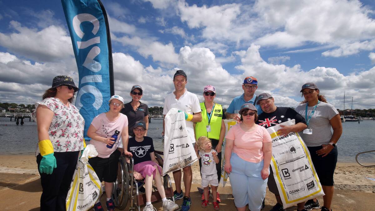 A group from Civic Industries with Cronulla MP Mark Speakman cleaning up at Gunnamatta Bay in 2019. Picture: Chris Lane