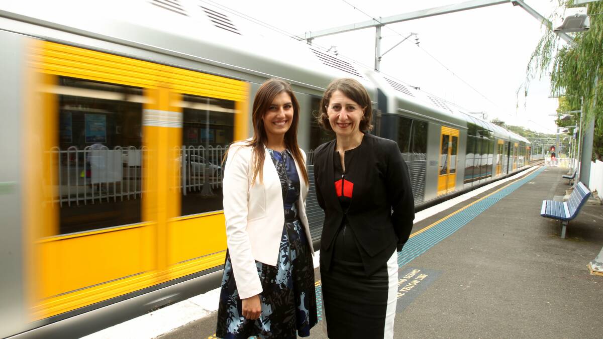 Eleni Petinos and Gladys Berejiklian in happier times at Jannali station. Picture: Chris Lane