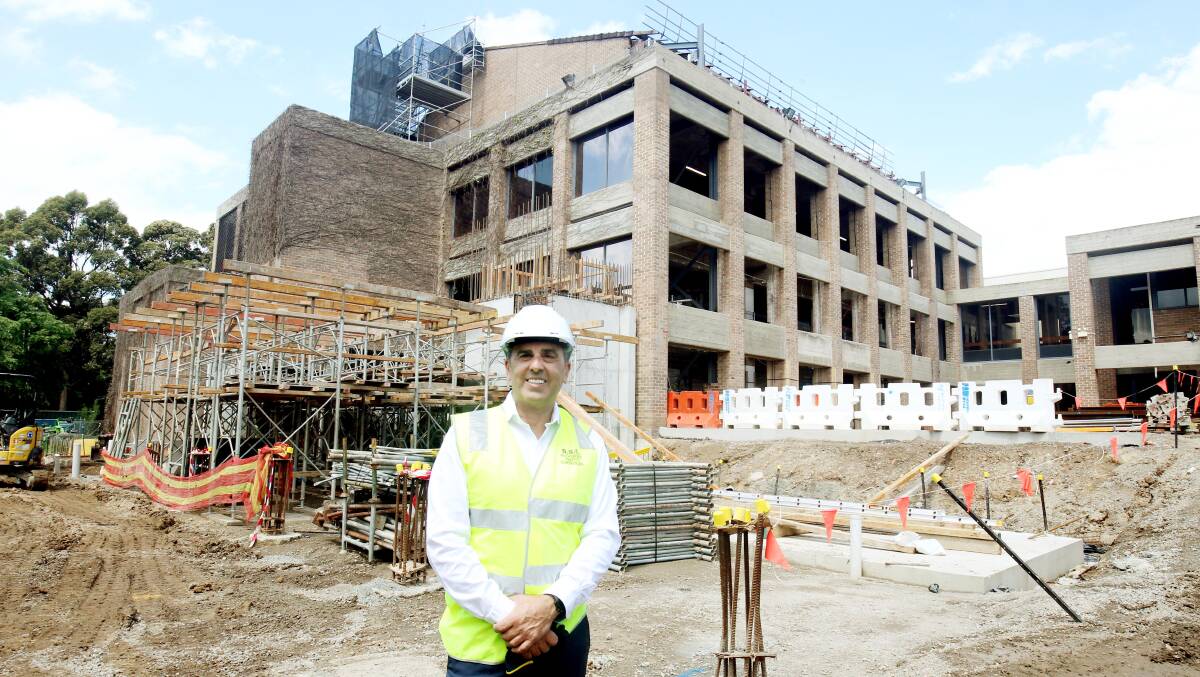 Mayor Carmelo Pesce in late 2021 on the site of the redevelopment of Sutherland Entertainment Centre, which is the council's current biggest infrastructure project. Picture: Chris Lane