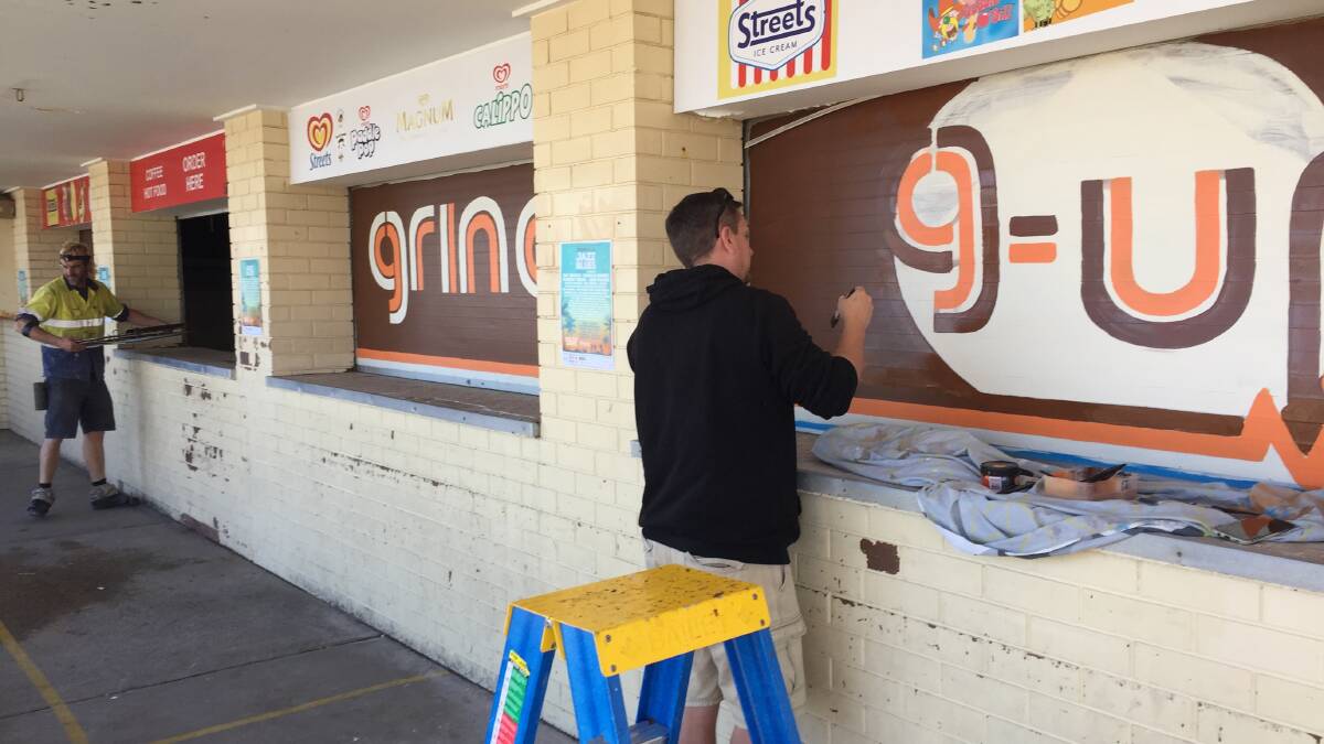 Tradesmen at work at the former kiosk, which will become a Grind Espresso pop-up until the surf club redevelopment starts.