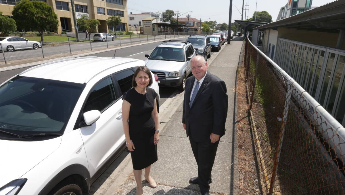 Gladys Berejiklian and Lee Evans promising more parking at Engadine station. Picture: John Veage