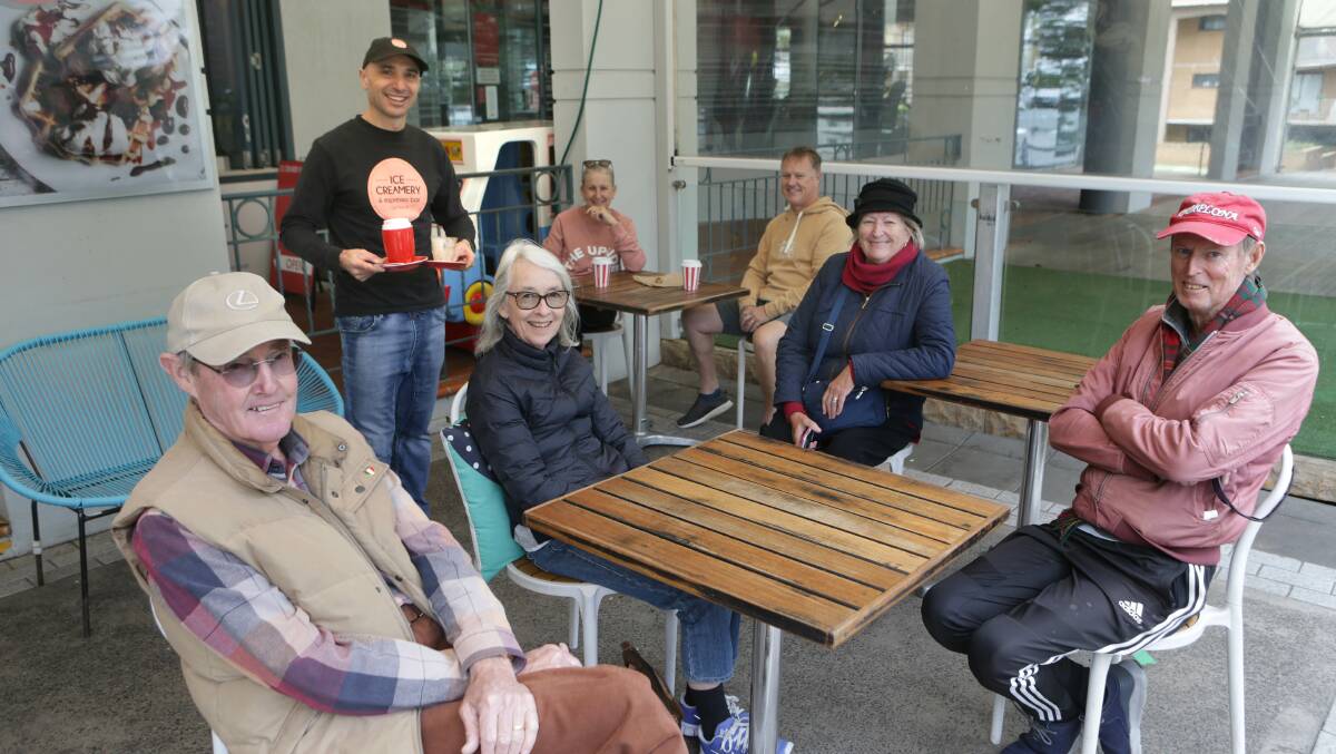 Cronulla Ice Creamery proprietor Harry Adam and customers enjoy the reopening of cafes for sitting-in on May 16. Picture: John Veage