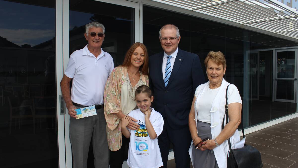 Community support: Carolyn Laney and her daughter Neave with Scott Morrison and Colin and Barbara Fletcher, who organised the golf day. Picture: supplied