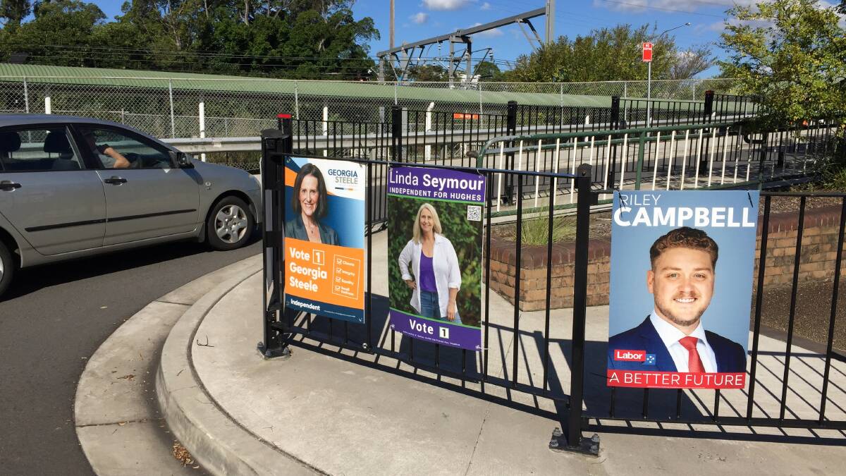 Election signs for Hughes candidates at Sutherland station.