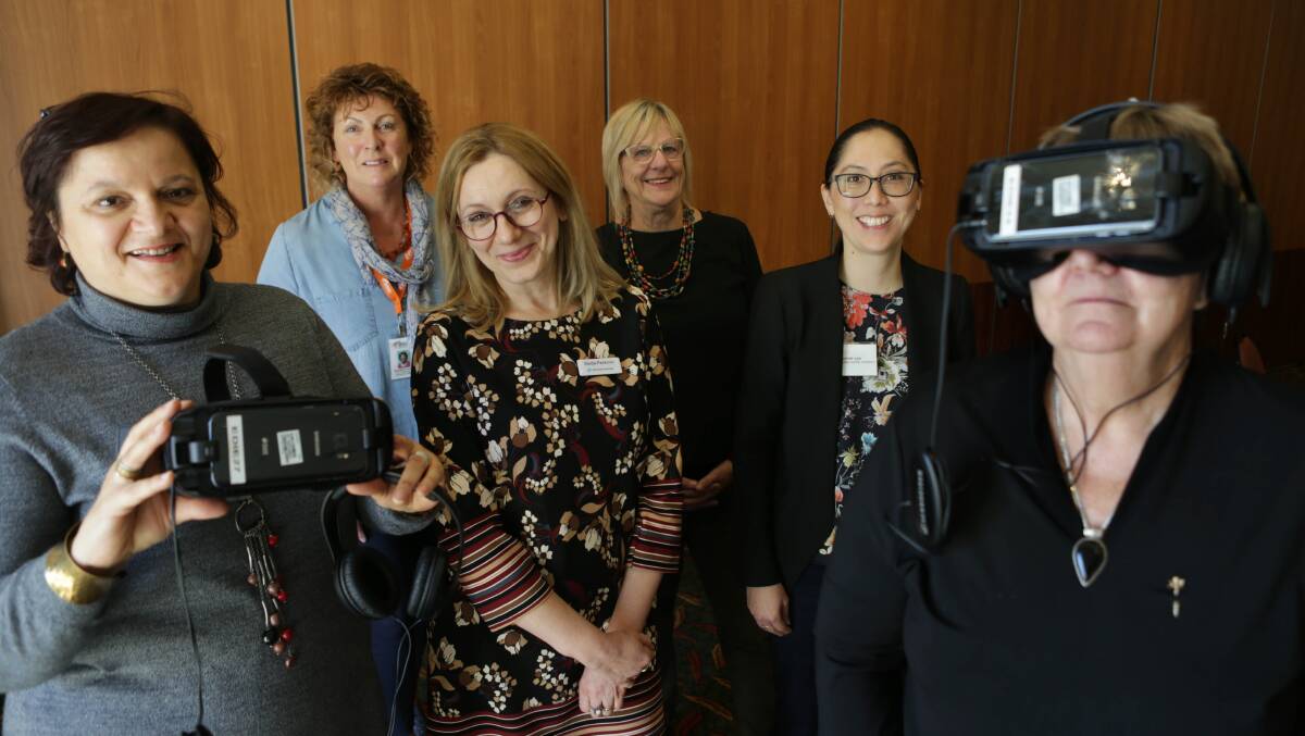 Virtual reality technology: Dragana Bozinovski (left), Sladana Pavkovic, Jatyne Gan, Bernadette Frawley, Libby Palmer and Cherie wearing the glasses. Picture: John Veage