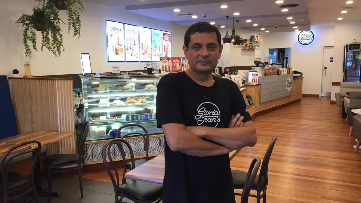 Thousands of small business owners, such as Sayeed Haque, who operates Gloria Jean's cafe at Gymea, may be eligible for state government grants of up to $10,000. 