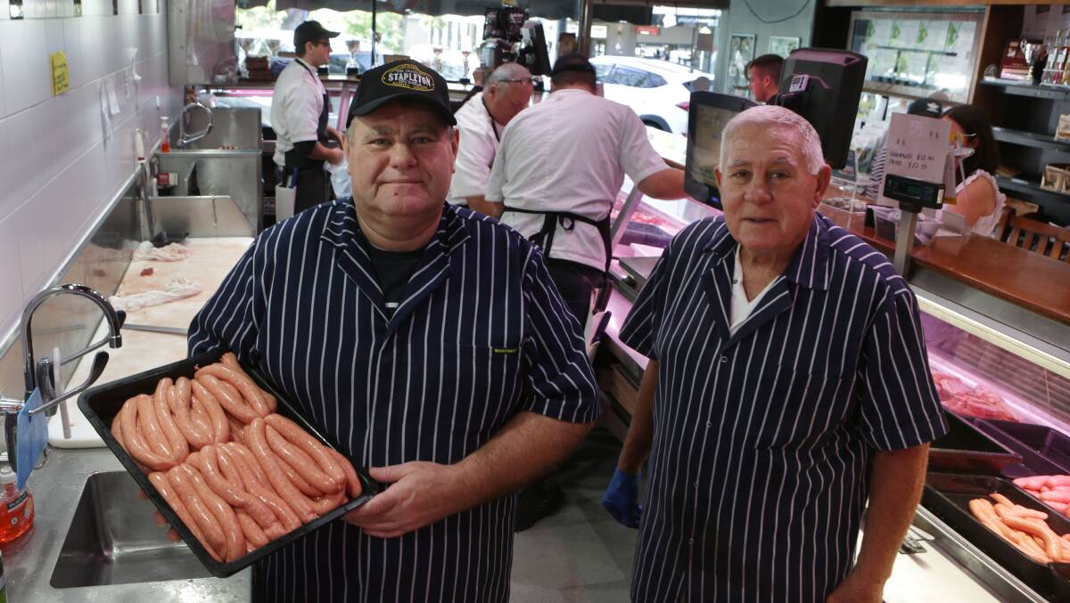 Mark (left) and Ron Stapleton with a pack of sausages that are in big demand. Picture: John Veage
