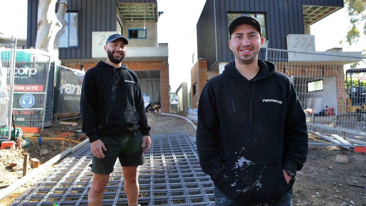 "Hard yakka": Billy (front) and Sam Hammoud working as builders labourers. Picture: John Veage