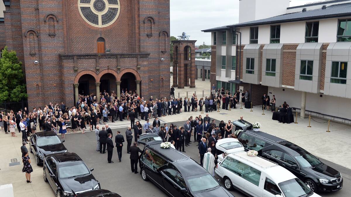 Family and friends farewell Lars, Vivian and Annabelle Falkholt, who were killed in a car accident on Boxing Day. Picture: Jeremy Piper, AAP