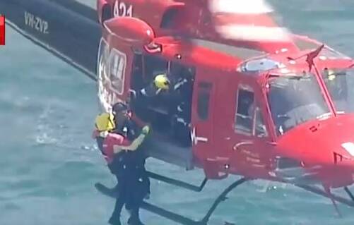 A survivor is winched to safety after a boat capsized at Kurnell. Picture: 7 News
