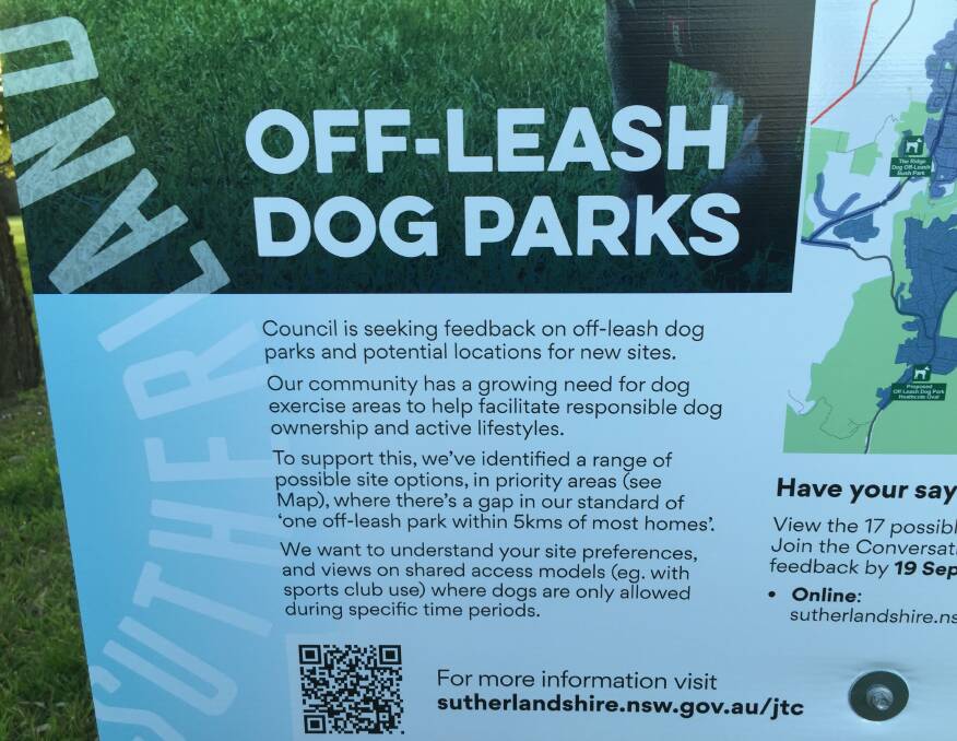 A sign advising of the off-leash dog parks consultation.