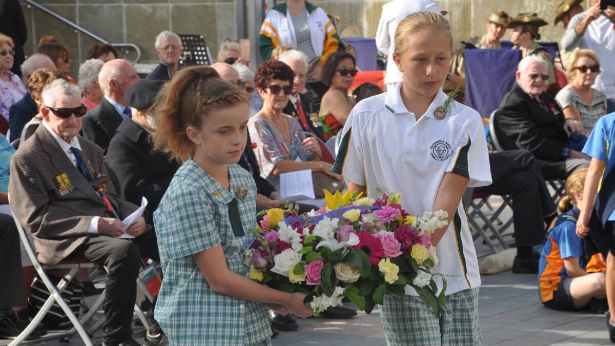 Pupils from Engadine West Public School lay a wreath at the Anzac commemoration at the Engadine War Memorial on Sunday.
