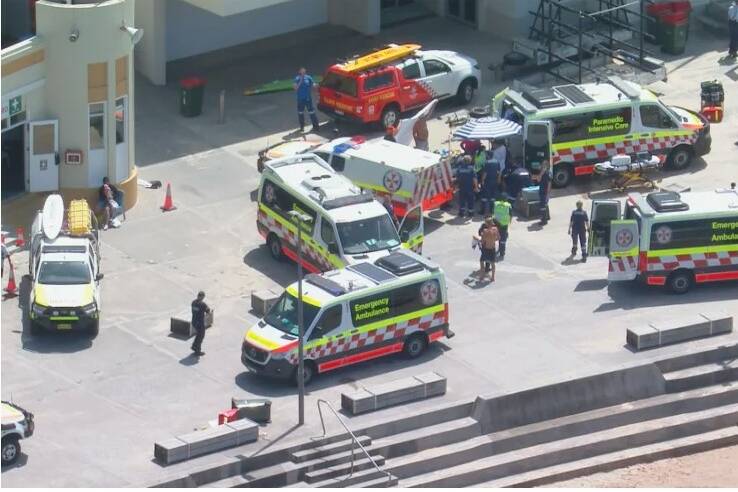 Ambulances wait at Cronulla beach for jet skis from the scene of the tragedy. Picture 9 News