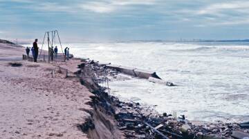 A solitary swing is all that remained of the playground equipment at North Cronulla beach after the 1974 storms. Picture Sutherland Shire Libraries