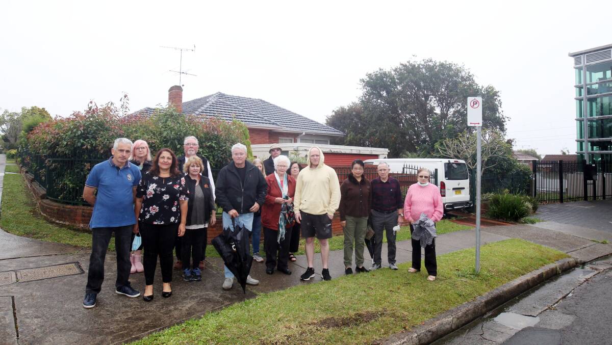 Strongly opposed: Residents in front of the proposed development site at 1 Panorama Avenue, next to Woolooware station. Picture: Chris Lane