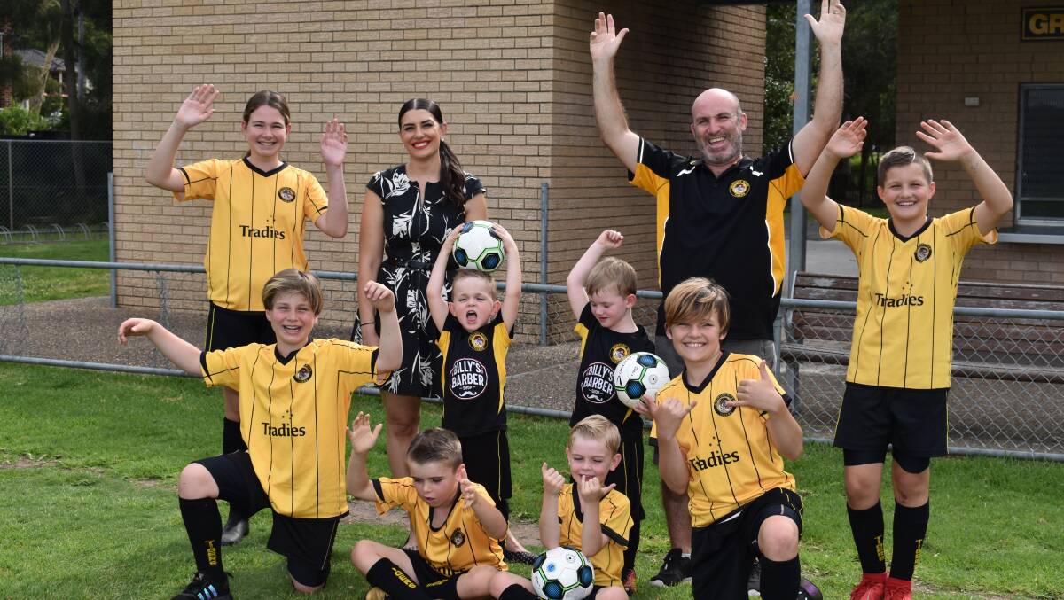 Georges River Football Club president Dale Graham and players with Miranda MP Eleni Petinos. Picture: supplied