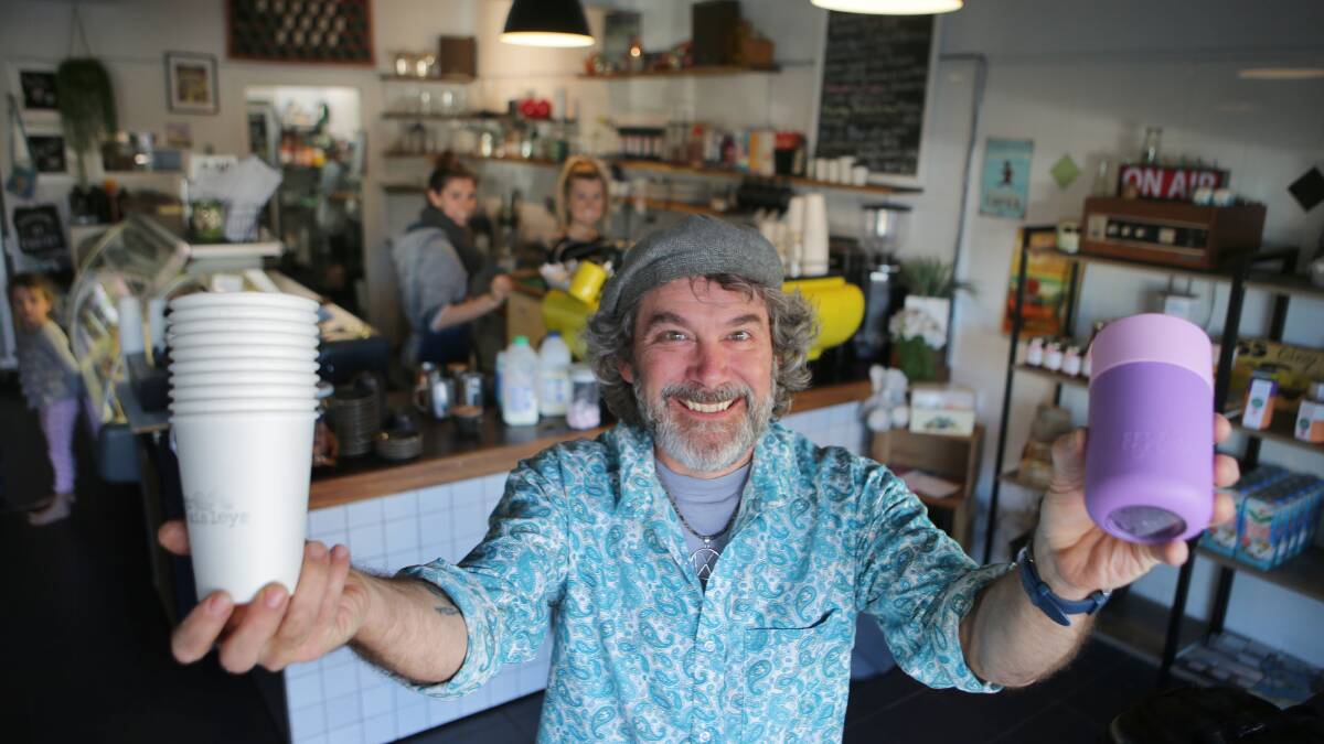 Waste conscious: Peter Nolan from Mr Paisley's Cafe in Caringbah, one of several cafes in the shire who offer a discount to customers who bring their own mug.  Picture: John Veage