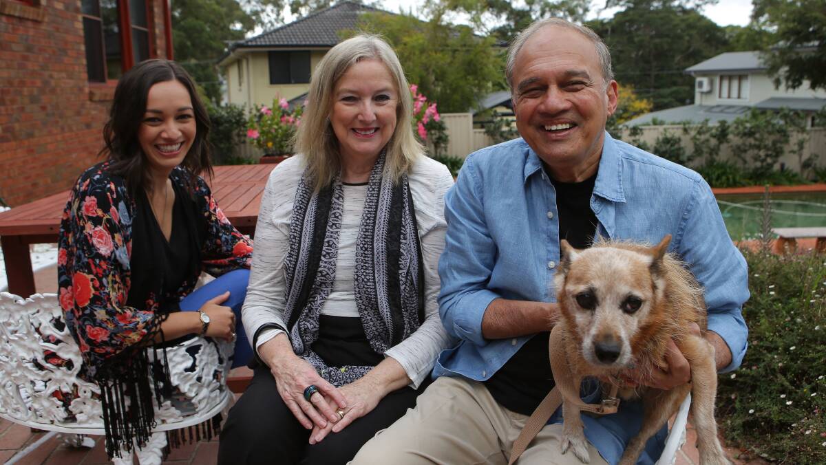 Grateful for support: Dr Kiran Phadke with his wife Linda, daughter Alana and their dog Rusty, who they retrieved from the council pound in 2003 after he was featured as the Leader's Dog of the Week. Picture: John Veage