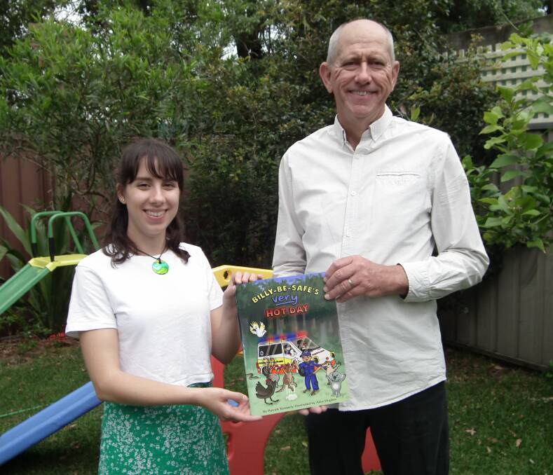 Alice Hughes and Patrick Kennedy with a copy of their new book, Billy Be Safe's Very Hot Day. Picture: supplied