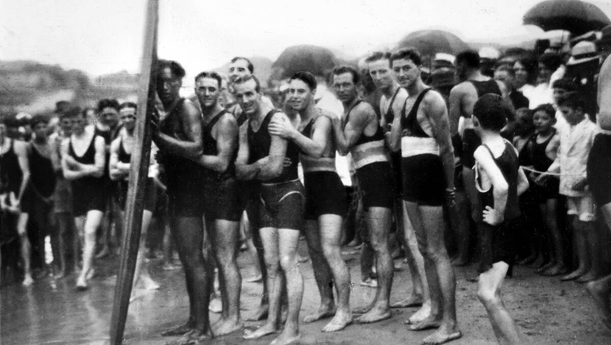 1915: Duke Kahanamoku and Cronulla Surf Life Saving Club members on Cronulla beach after the Duke had a surf at North Cronulla.